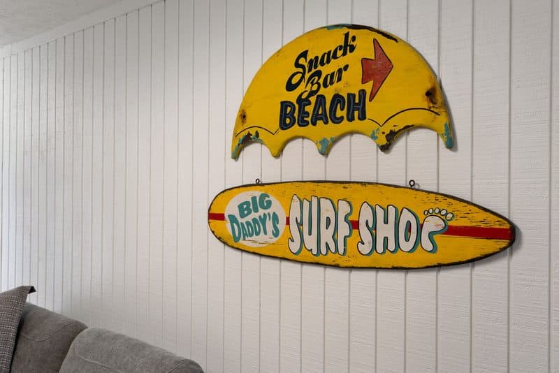 Surf shop signs in the garage hangout